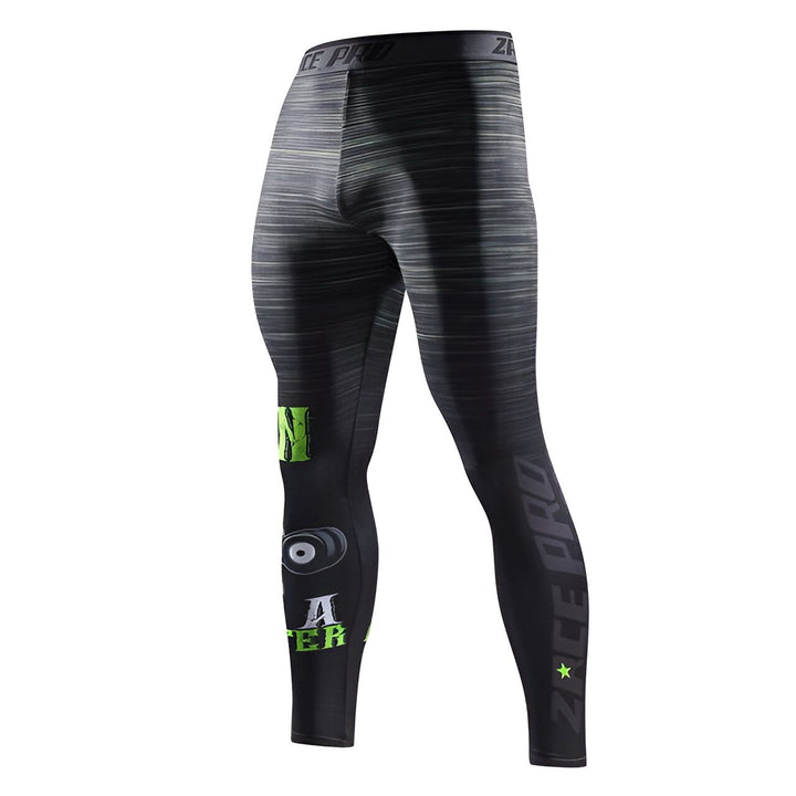 L'image représente un legging de sport noir et gris avec des motifs verts. Il est porté par un mannequin.,LE-612421136X,LE-082998786X,LE-2548664961,LE-8600029902