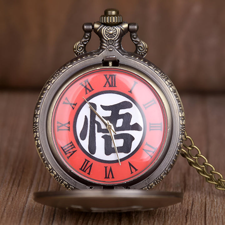 Une montre de poche en métal avec un cadran rouge et un symbole japonais noir au centre.,MO-0749564164