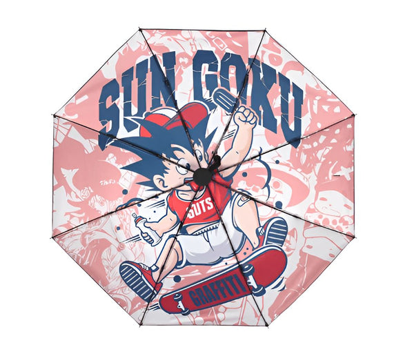 Une image d'un parapluie rose avec un motif de Son Goku, un personnage de Dragon Ball Z. Il est représenté en train de faire du skateboard et porte une casquette rouge et un t-shirt blanc. Le parapluie est ouvert et on peut voir le dessous de la toile qui est blanche avec des motifs de graffitis.,PA-5251288662