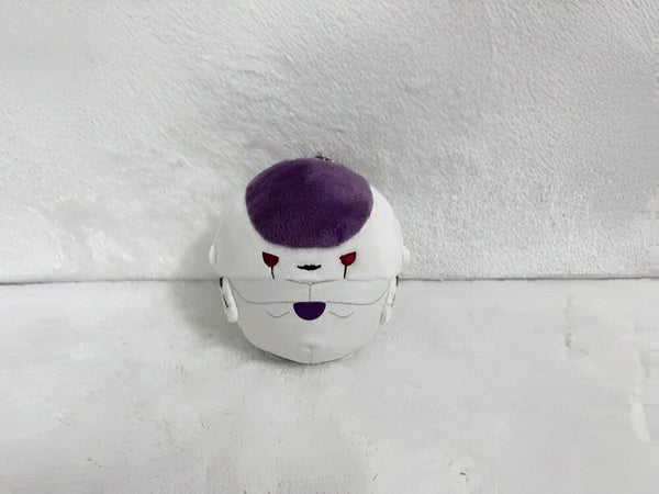 Une peluche de Freezer, un personnage de Dragon Ball Z. Il est blanc et violet, avec une tête ronde et des yeux rouges. Il est vêtu d'une combinaison de combat violette et blanche.,PE-3037112948