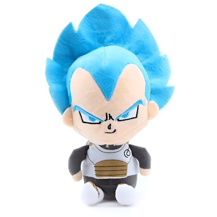 Une peluche de Vegeta, un personnage de la série Dragon Ball Z. Il est assis avec un sourire narquois sur le visage. Il porte son costume de combat Saiyan, avec une armure bleue et jaune et des bottes blanches. Ses cheveux sont bleus et hérissés.,PE-1196107912