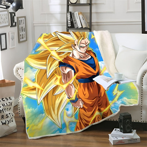 Une couverture en polaire avec un imprimé du personnage de Son Goku, un personnage de la série animée Dragon Ball Z. Il est représenté avec ses cheveux longs et blonds et sa combinaison orange. Il est entouré d'éclairs et de nuages.,PL-8154752050,PL-0223590231