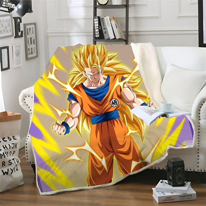 Une couverture en polaire avec Son Goku, un personnage de Dragon Ball Z, en train de se transformer en Super Saiyan. Il est entouré d'éclairs jaunes et porte une combinaison orange et bleue.,PL-1635538556,PL-9656714385