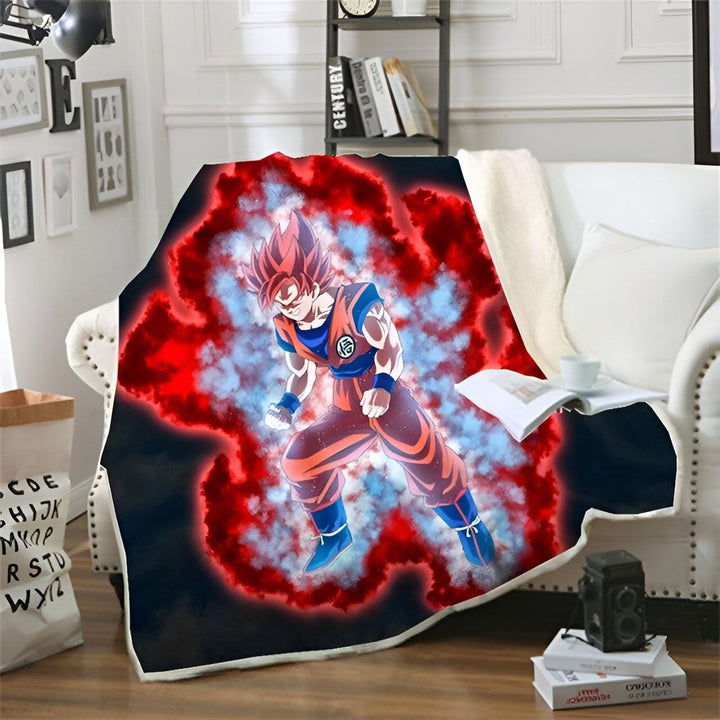 Une couverture en polaire avec Son Goku, un personnage de Dragon Ball Z, en train de se transformer en Super Saiyan. Il est entouré d'une aura rouge et bleue.,PL-7825187180,PL-1152874675