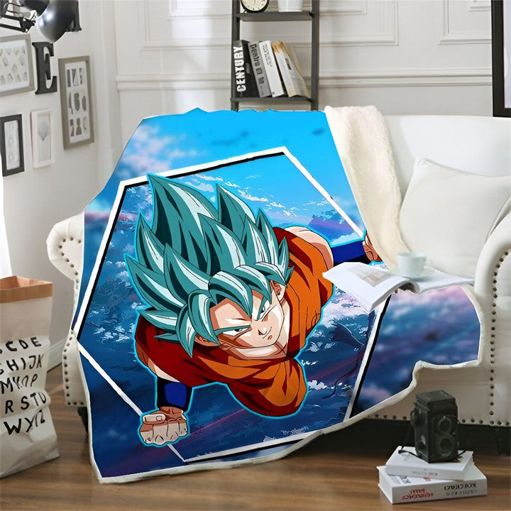 Une couverture en polaire avec un imprimé du personnage de Son Goku, un personnage de la série animée Dragon Ball Z. Il est représenté en train de voler dans les airs, avec ses cheveux bleus et sa combinaison orange. La couverture est bleue et blanche.,PL-9981607630,PL-1654784672