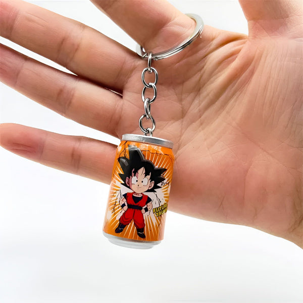 Un porte-clés en forme de canette de boisson gazeuse orange avec un personnage de dessin animé dessus.,PO-7969421350