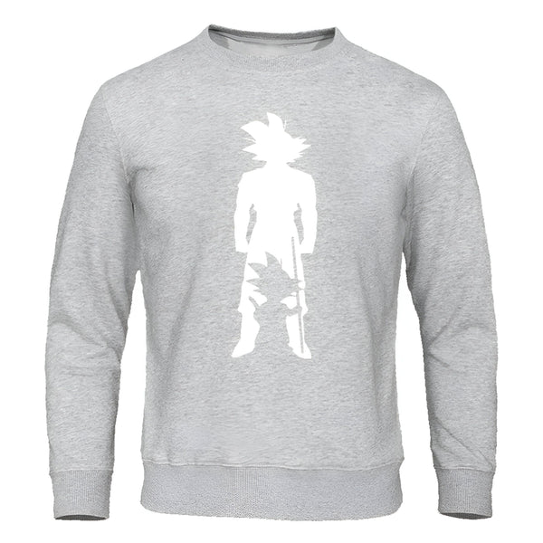 Le sweat-shirt gris représente Son Goku, un personnage de la série animée japonaise Dragon Ball Z. Il est vêtu de son costume de combat orange et bleu et tient son bâton magique à la main.