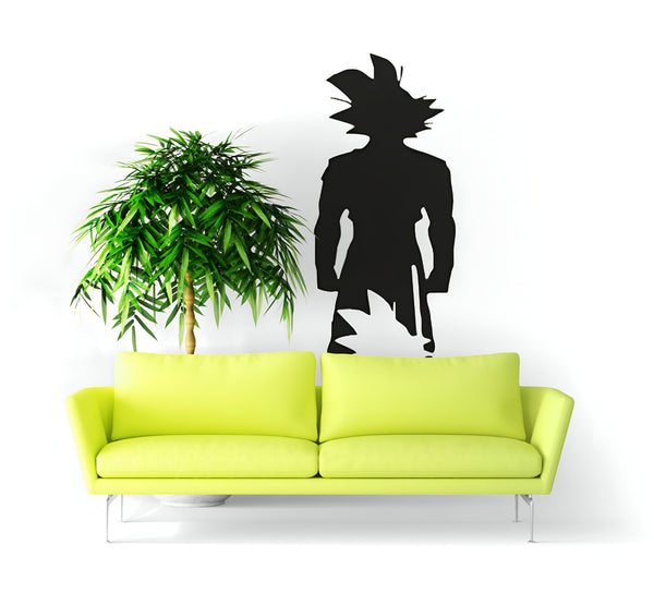 Une image d'un salon avec un canapé vert et une plante verte à côté. Il y a aussi un sticker mural de Son Goku, un personnage de Dragon Ball Z.,ST-9087151799,ST-8591872371,ST-2708738216,ST-3930772825,ST-930903243X,ST-5752931460