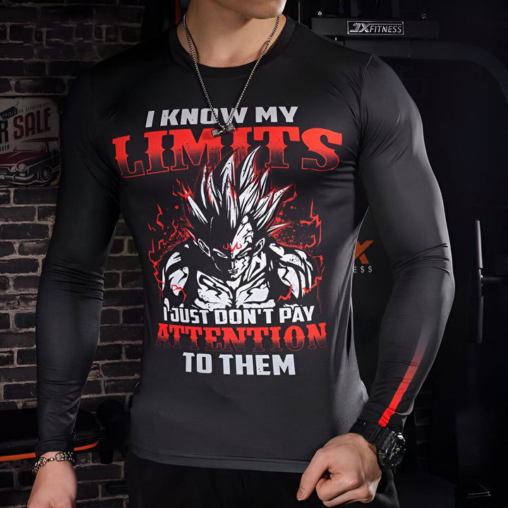 Un homme porte un t-shirt noir avec un motif de Son Goku, un personnage de Dragon Ball Z. Le texte sur le t-shirt dit "I know my limits, I just don't pay attention to them".,T--4099610632,T--4192845784,T--2635183023,T--4920177542,T--1779509103