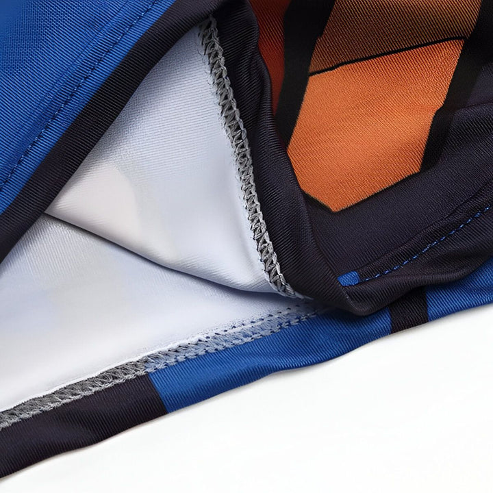 Une image en gros plan d'un vêtement de sport bleu et orange avec des coutures apparentes.,T--7663222652,T--5989670826,T--9442091786,T--8470437577,T--7431847505,T--4599751499,T--9963113028,T--6402756075