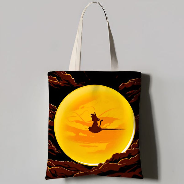 Un sac fourre-tout en toile de couleur noire avec une image de Son Goku, un personnage de la série animée Dragon Ball Z, volant sur son nuage magique.,TO-4890395326